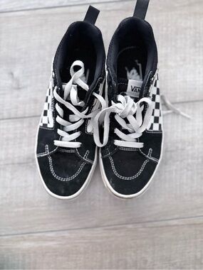 Black with checkered Vans
